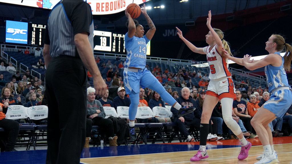 Georgia Woolley playing defense on the arch against North Carolina Trayanna Crisp. 